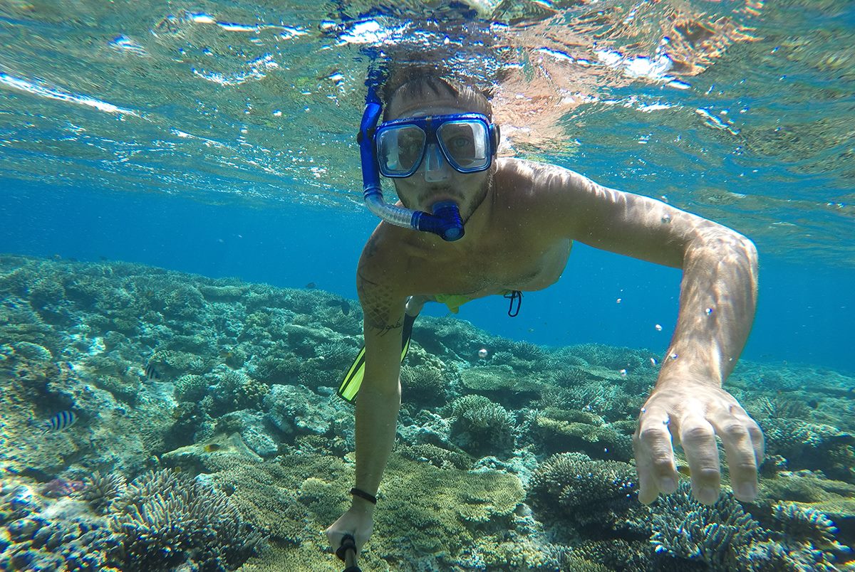 No wind activity. Kite boarder ditches his board, dons his blue mask and snorkel and goes snorkelling in the Red Sea